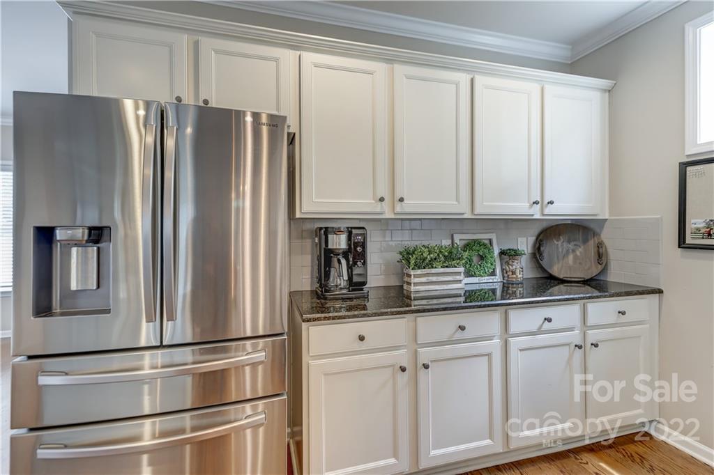 3558 Richard's Crossing Fort Mill, SC 29708 - Photo 12 of 35 a kitchen with stainless steel appliances granite countertop a refrigerator and a stove top oven