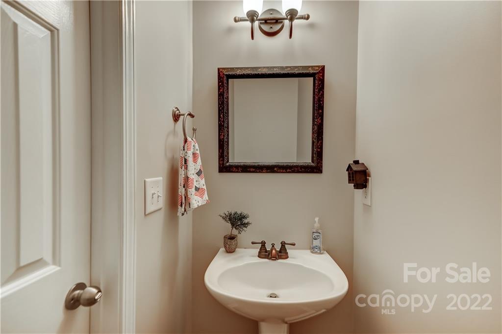 3558 Richard's Crossing Fort Mill, SC 29708 - Photo 17 of 35 a bathroom with a sink and mirror