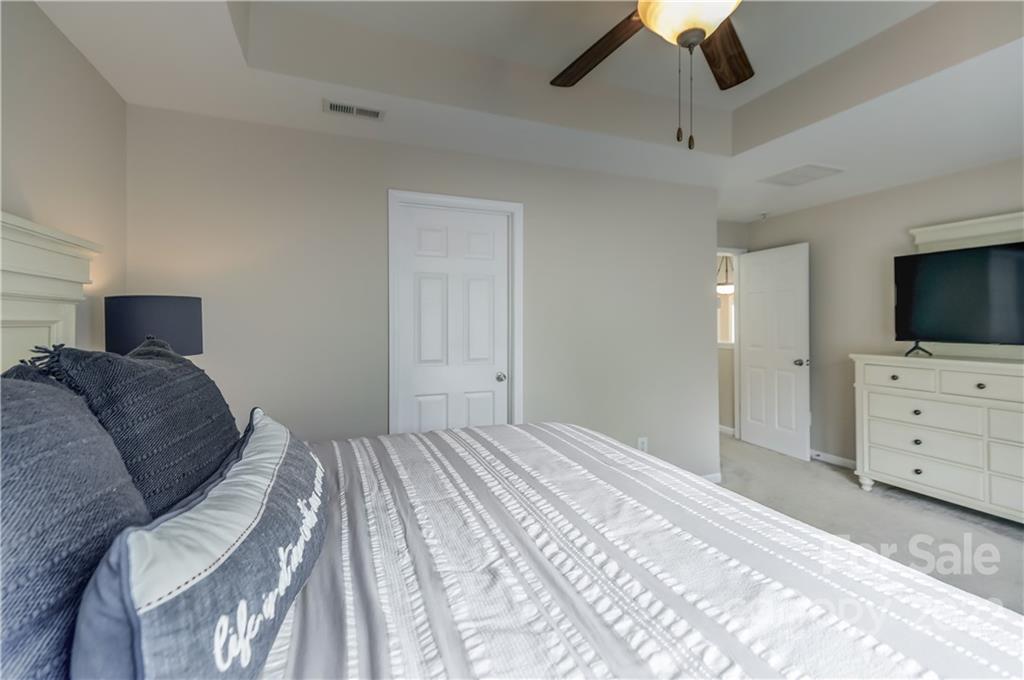 3558 Richard's Crossing Fort Mill, SC 29708 - Photo 20 of 35 a bedroom with a bed and flat screen tv