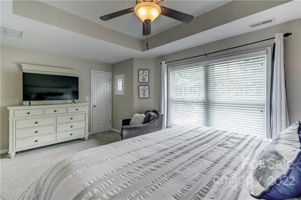3558 Richard's Crossing Fort Mill, SC 29708 - Photo 21 of 35 a bedroom with a bed and a flat screen tv