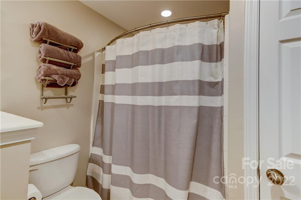 3558 Richard's Crossing Fort Mill, SC 29708 - Photo 23 of 35 a bathroom with a shower curtain and a toilet