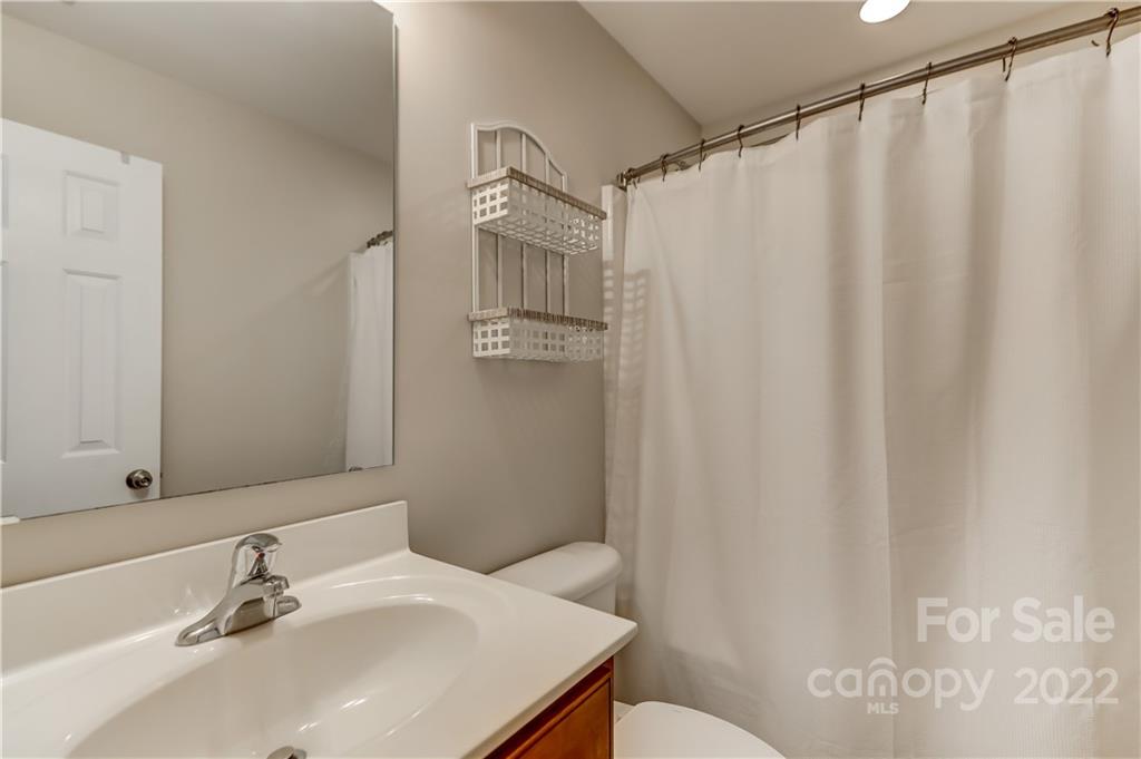 3558 Richard's Crossing Fort Mill, SC 29708 - Photo 26 of 35 a bathroom with a sink and a mirror