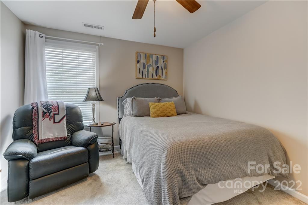 3558 Richard's Crossing Fort Mill, SC 29708 - Photo 27 of 35 a bedroom with a bed couches and window