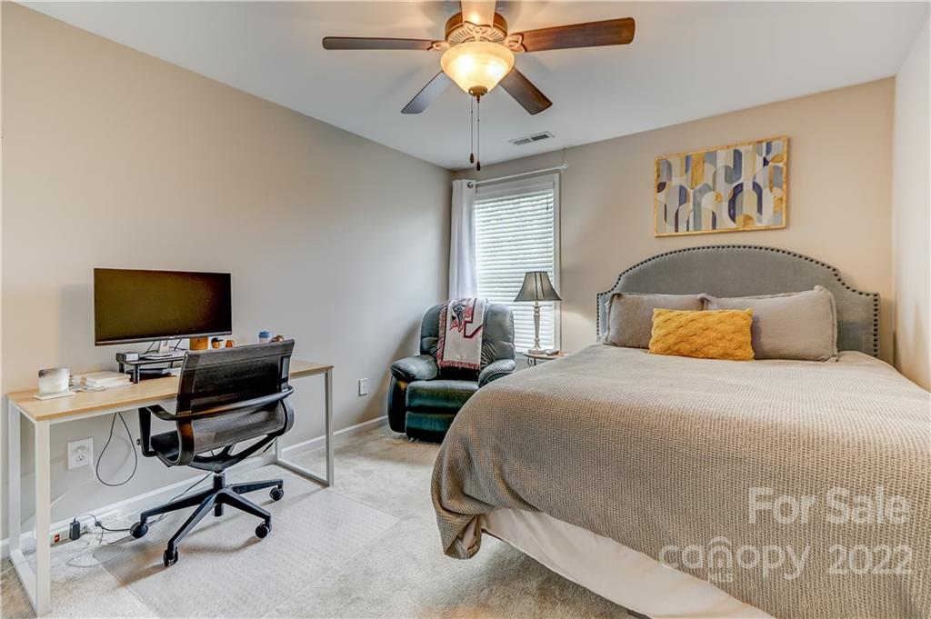 3558 Richard's Crossing Fort Mill, SC 29708 - Photo 28 of 35 a bedroom with a bed and a flat screen tv