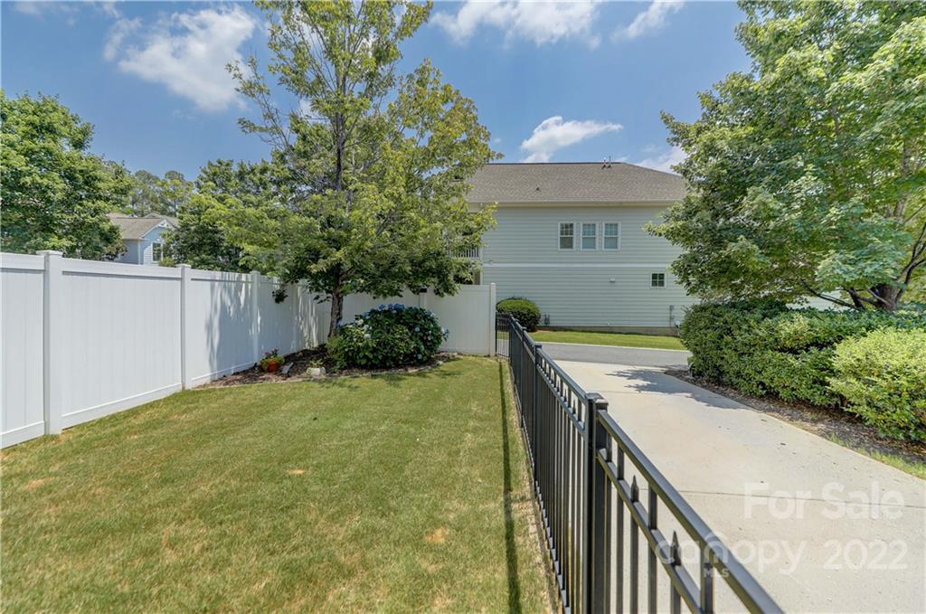 3558 Richard's Crossing Fort Mill, SC 29708 - Photo 30 of 35 a front view of house with yard and trees in the background