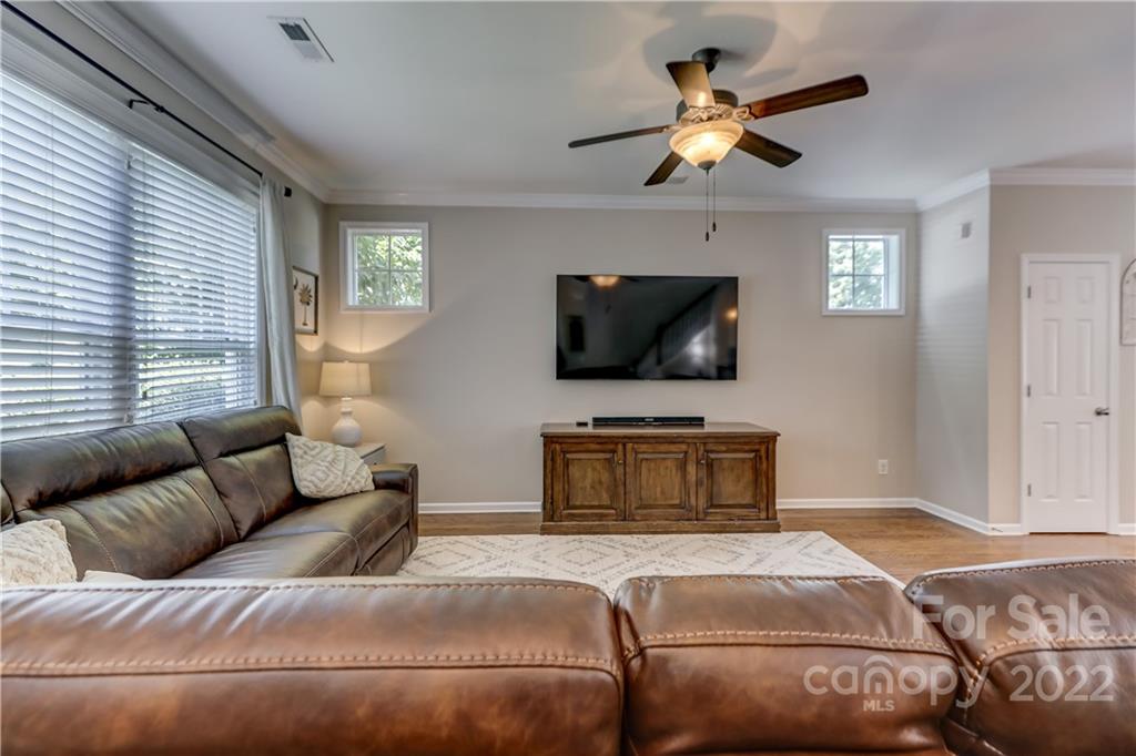 3558 Richard's Crossing Fort Mill, SC 29708 - Photo 6 of 35 a living room with a couch and a flat screen tv