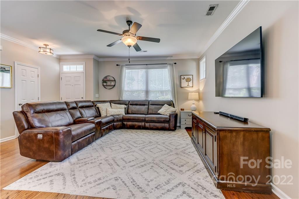 3558 Richard's Crossing Fort Mill, SC 29708 - Photo 7 of 35 a living room with furniture and a chandelier