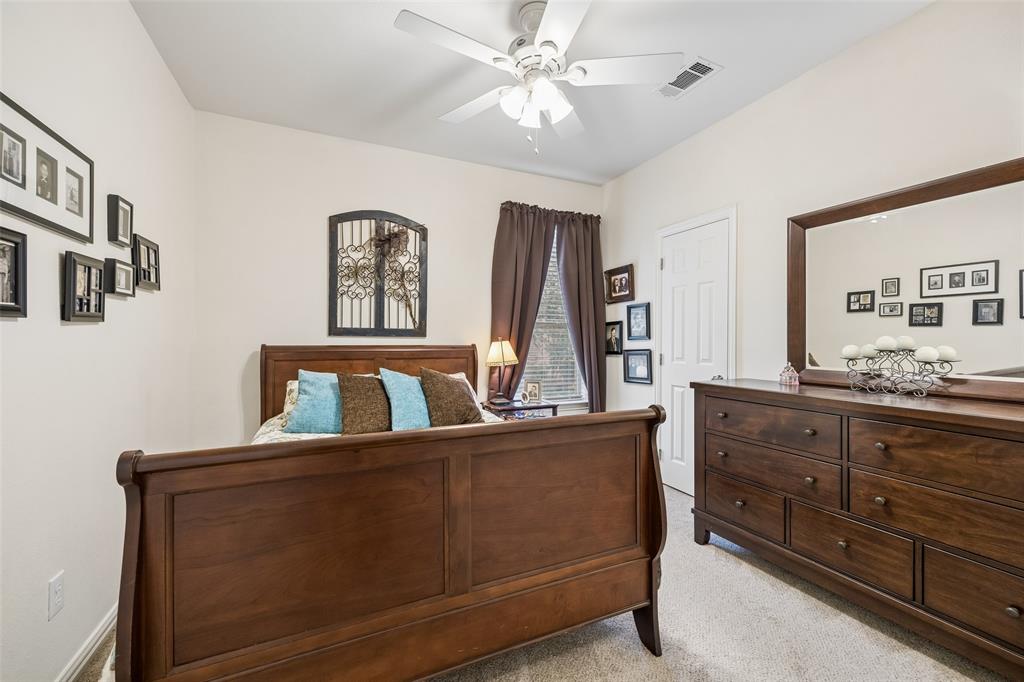 403 Springtree Road Lake Dallas, TX 75065 - Photo 16 of 34 a living room with furniture and paintings on the wall