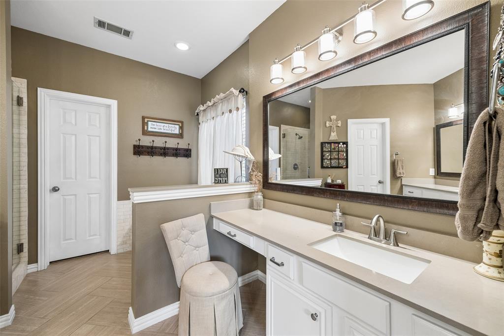 403 Springtree Road Lake Dallas, TX 75065 - Photo 21 of 34 a bathroom with a sink and a mirror