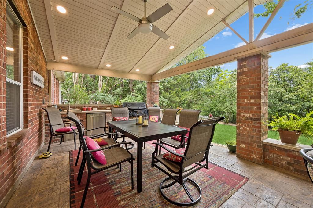 403 Springtree Road Lake Dallas, TX 75065 - Photo 31 of 34 a view of a patio with table and chairs and potted plants
