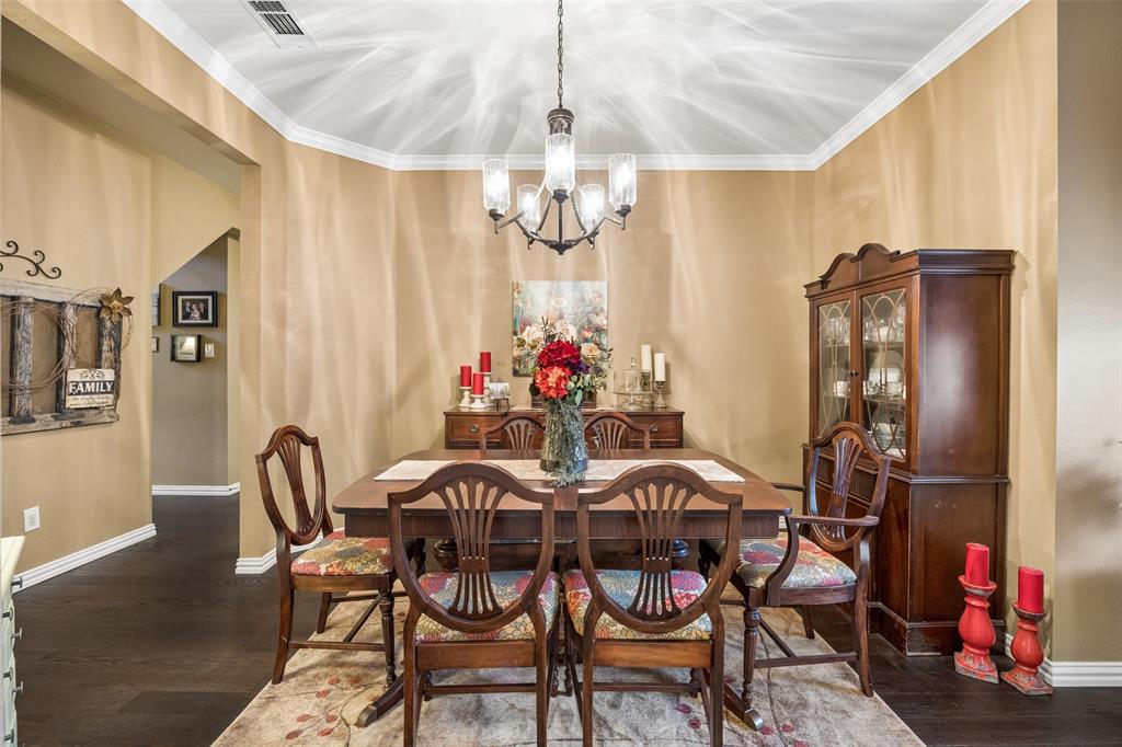 403 Springtree Road Lake Dallas, TX 75065 - Photo 4 of 34 a view of a dining room with furniture and chandelier