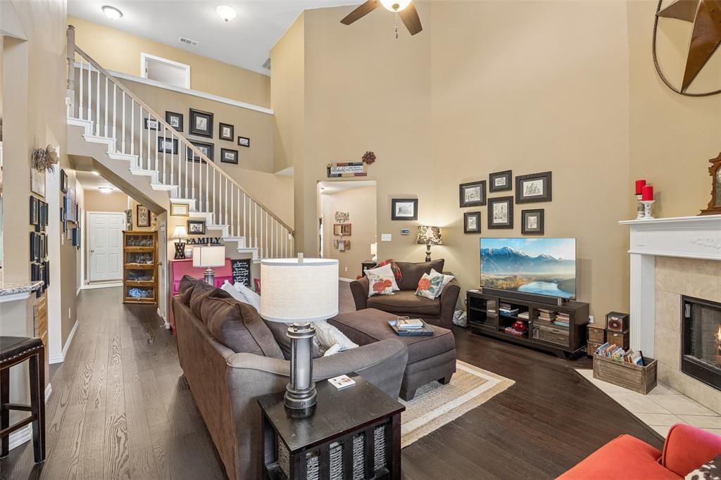 403 Springtree Road Lake Dallas, TX 75065 - Photo 9 of 34 a living room with furniture and a fireplace