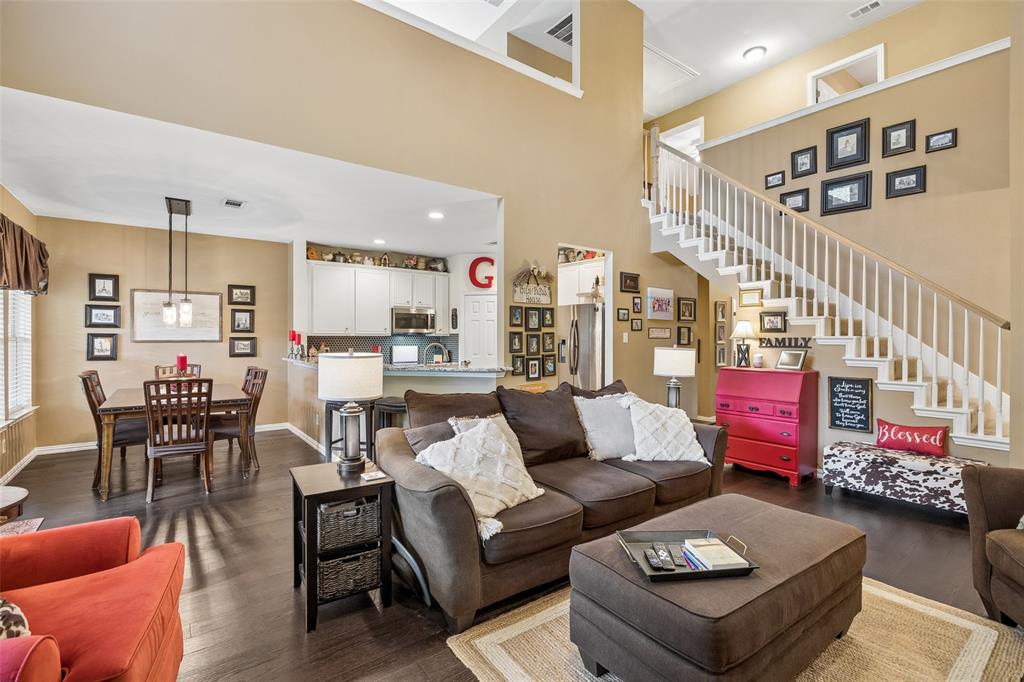 403 Springtree Road Lake Dallas, TX 75065 - Photo 10 of 34 a living room with furniture and a book shelf