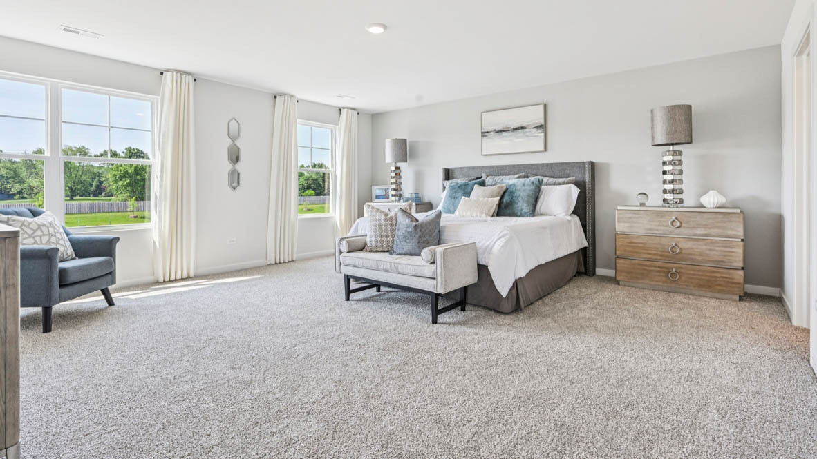 2311 Hirsch Road Oswego, IL 60543 - Photo 25 of 40 a bed room with a bed and a chair