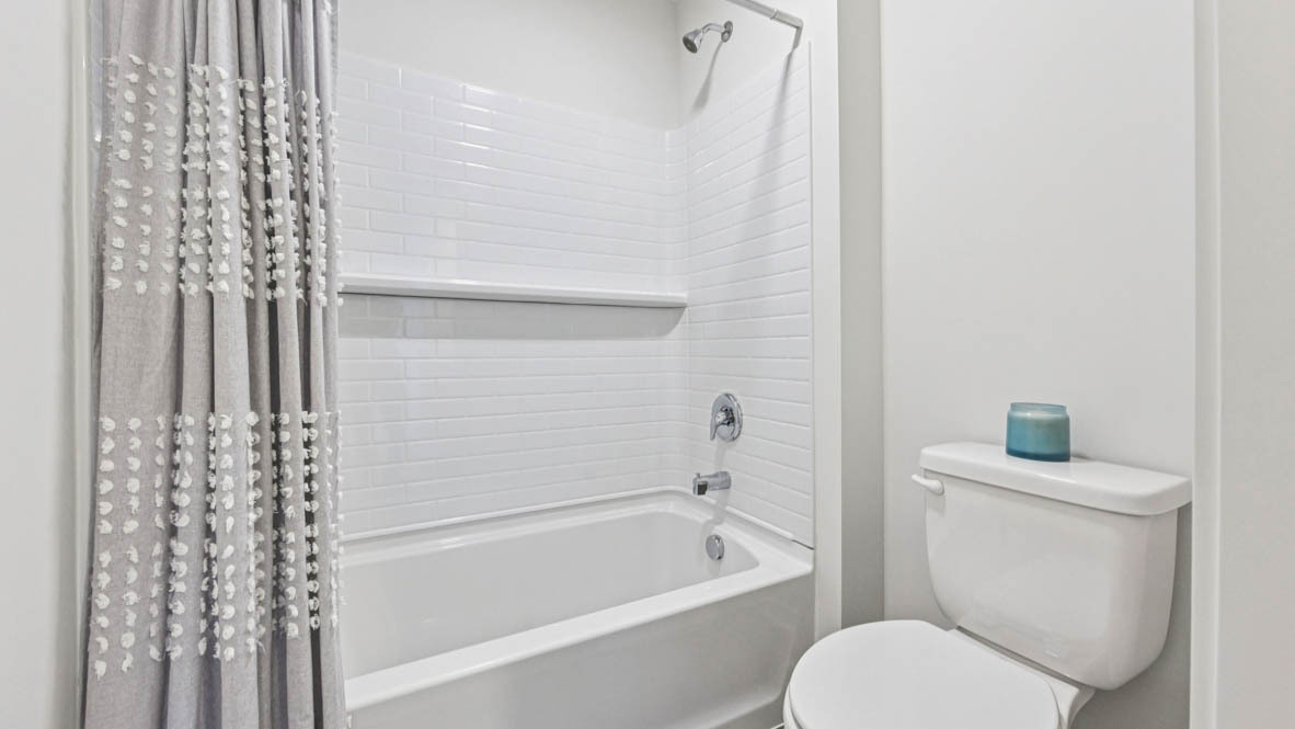 2311 Hirsch Road Oswego, IL 60543 - Photo 38 of 40 a bathroom with a toilet and a bathtub