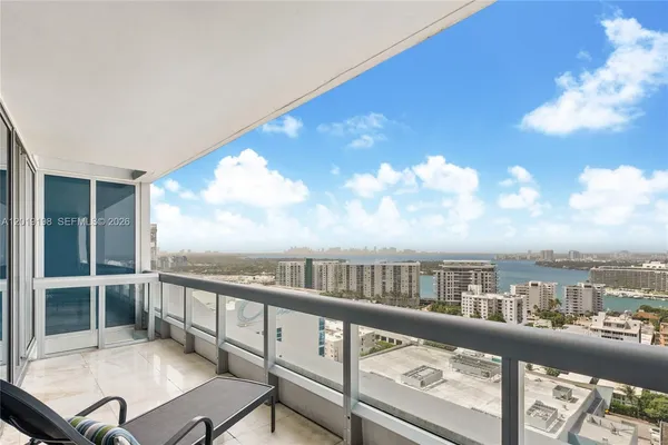 a view of a balcony with furniture