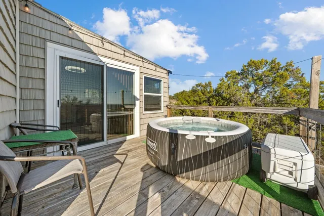 a view of a terrace with wooden floor and city view