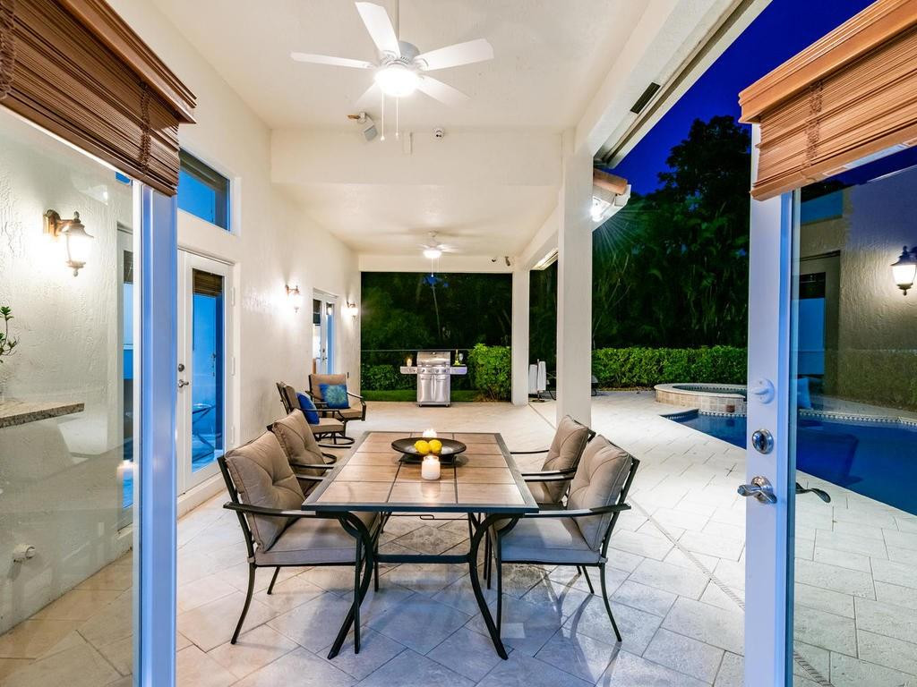 16500 Southwest 62nd Street Southwest Ranches, FL 33331 - Photo 14 of 100 a dining room with furniture wooden floor and a chandelier