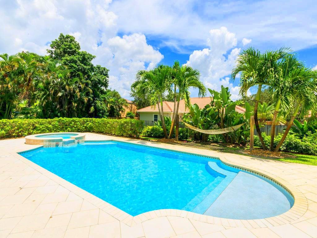 16500 Southwest 62nd Street Southwest Ranches, FL 33331 - Photo 47 of 100 a view of a swimming pool with an outdoor space and seating area