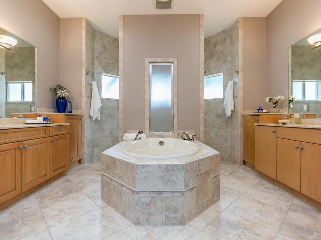 16500 Southwest 62nd Street Southwest Ranches, FL 33331 - Photo 49 of 100 a spacious bathroom with a sink a bathtub a mirror and vanity