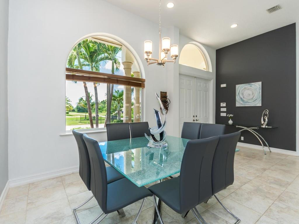 16500 Southwest 62nd Street Southwest Ranches, FL 33331 - Photo 5 of 100 a view of a dining room with furniture window and wooden floor