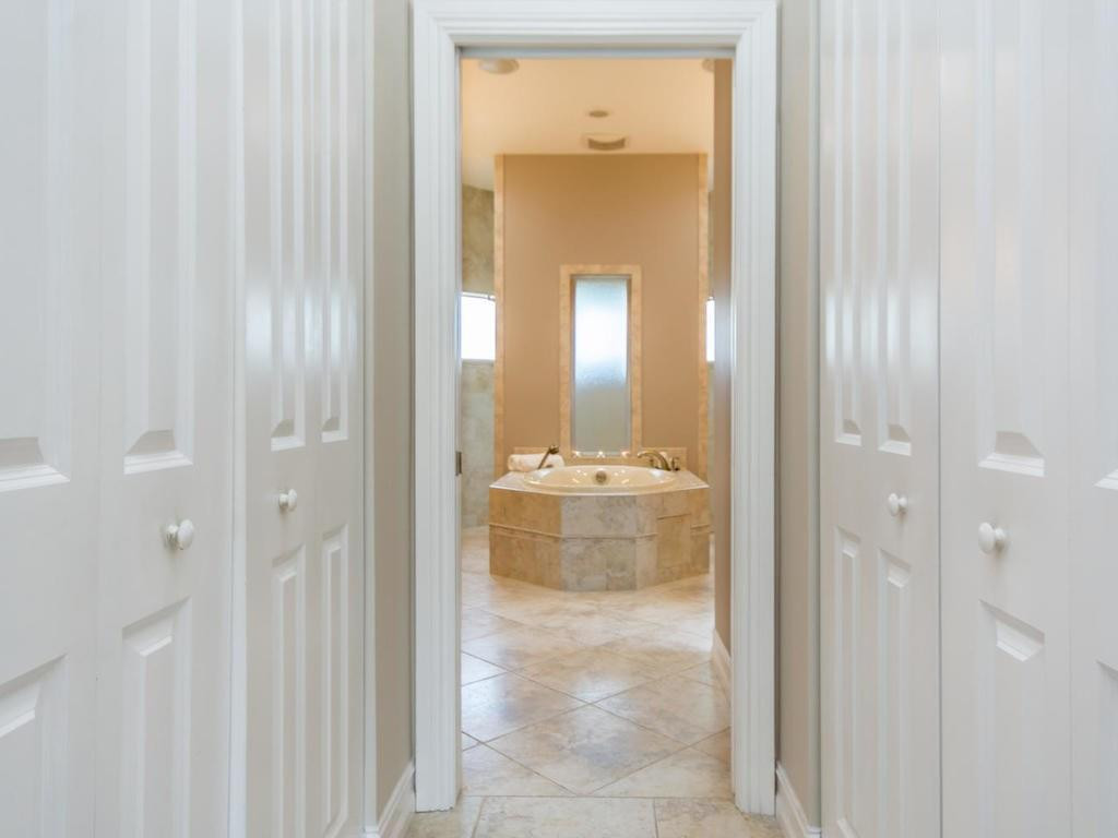 16500 Southwest 62nd Street Southwest Ranches, FL 33331 - Photo 54 of 100 a bathroom with a glass shower door