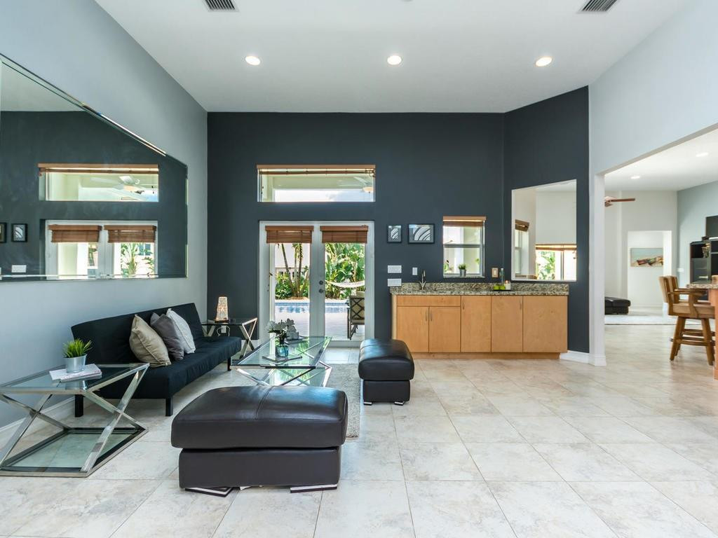 16500 Southwest 62nd Street Southwest Ranches, FL 33331 - Photo 6 of 100 a living room with furniture and a kitchen
