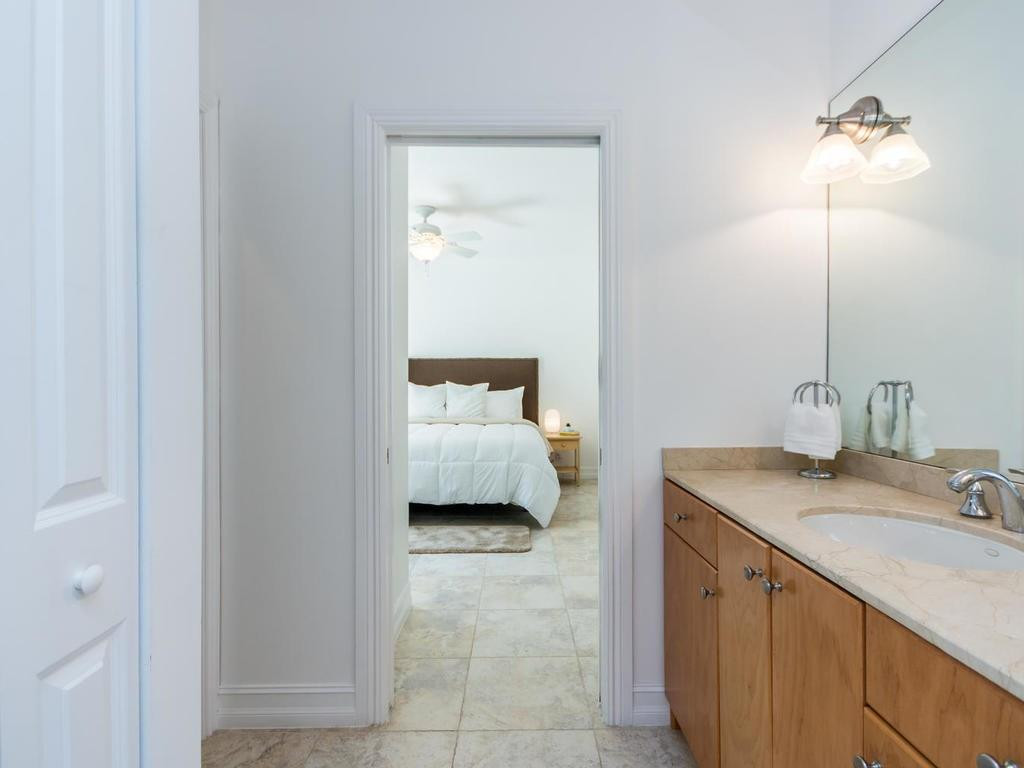 16500 Southwest 62nd Street Southwest Ranches, FL 33331 - Photo 61 of 100 a en suite bathroom with a sink and a mirror
