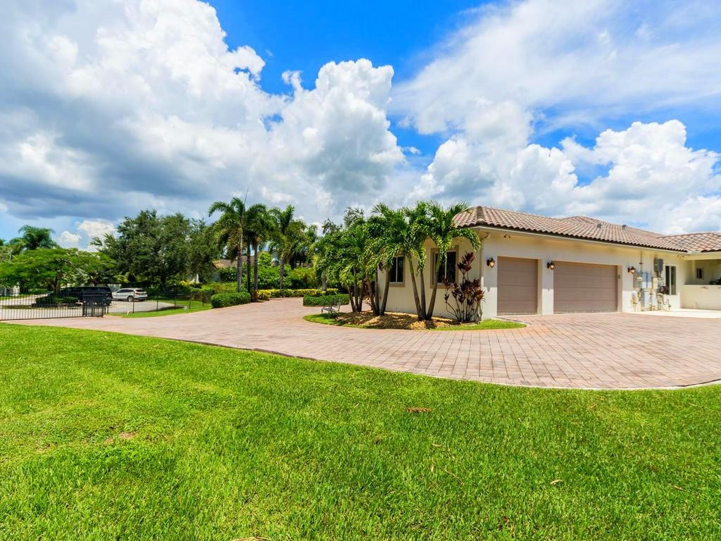16500 Southwest 62nd Street Southwest Ranches, FL 33331 - Photo 70 of 100 a view of a backyard with a garden