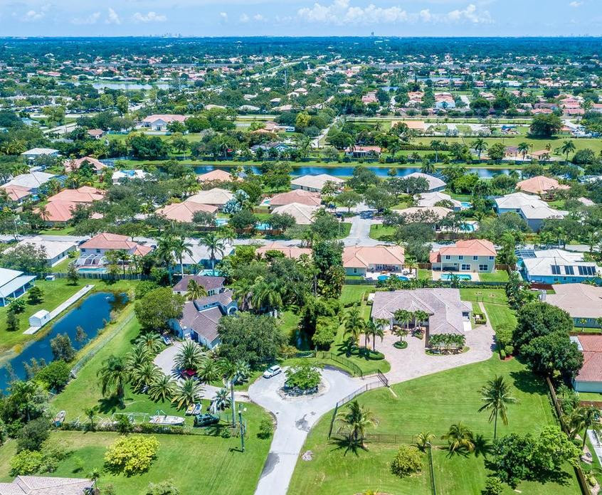 16500 Southwest 62nd Street Southwest Ranches, FL 33331 - Photo 84 of 100 an aerial view of residential houses with outdoor space and trees