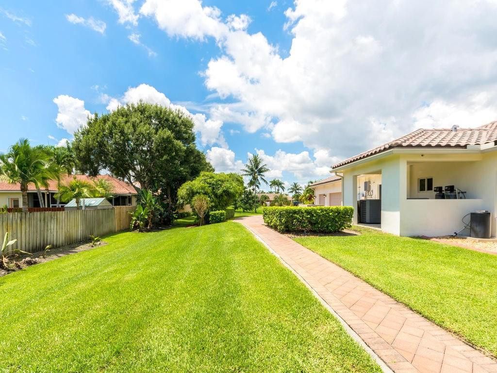 16500 Southwest 62nd Street Southwest Ranches, FL 33331 - Photo 85 of 100 a view of a house with a yard and a fountain