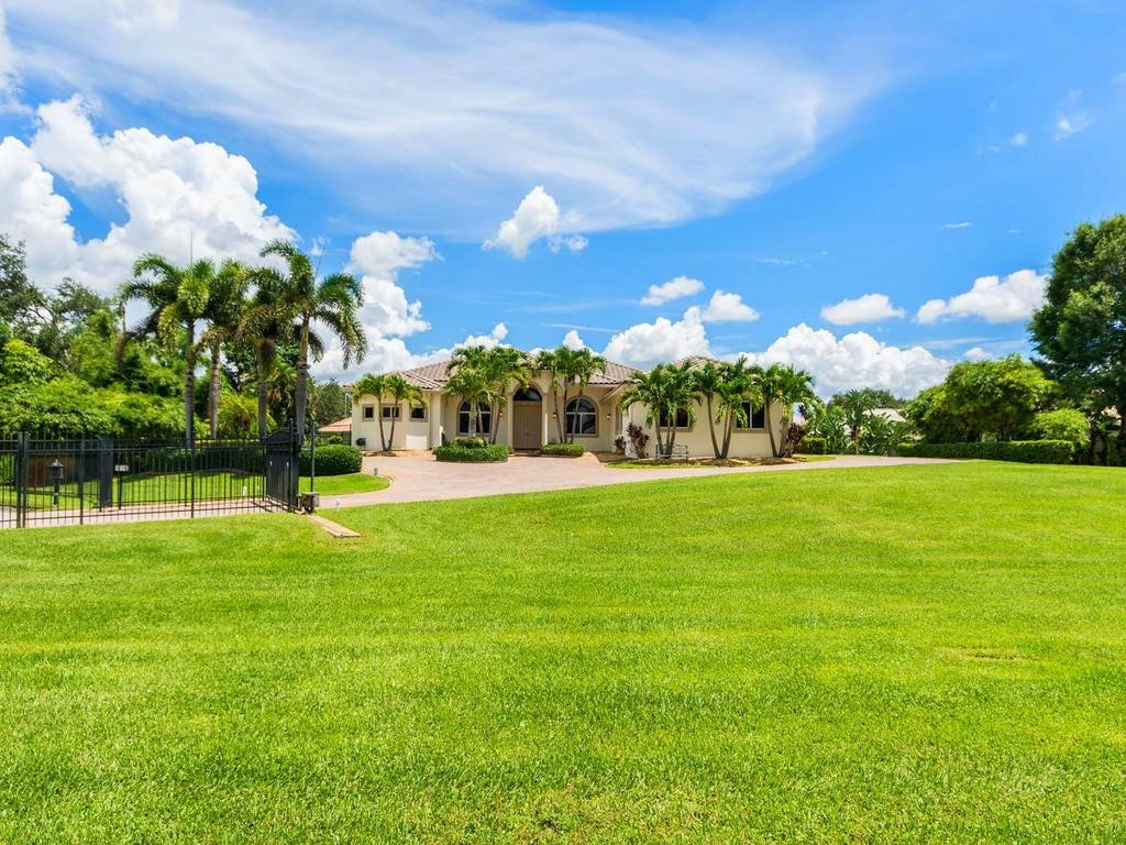 16500 Southwest 62nd Street Southwest Ranches, FL 33331 - Photo 10 of 100 a view of a house with a big yard