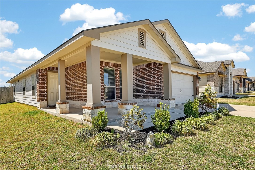 5235 Montague Loop Bryan, TX 77807 - Photo 3 of 25 a front view of a house with a yard