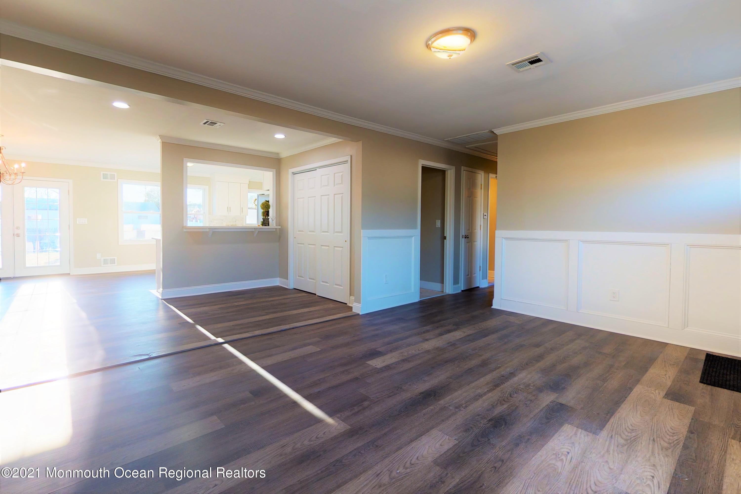 317 Stearman Road Brick, NJ 08723 - Photo 13 of 41 a view of an empty room with window and wooden floor