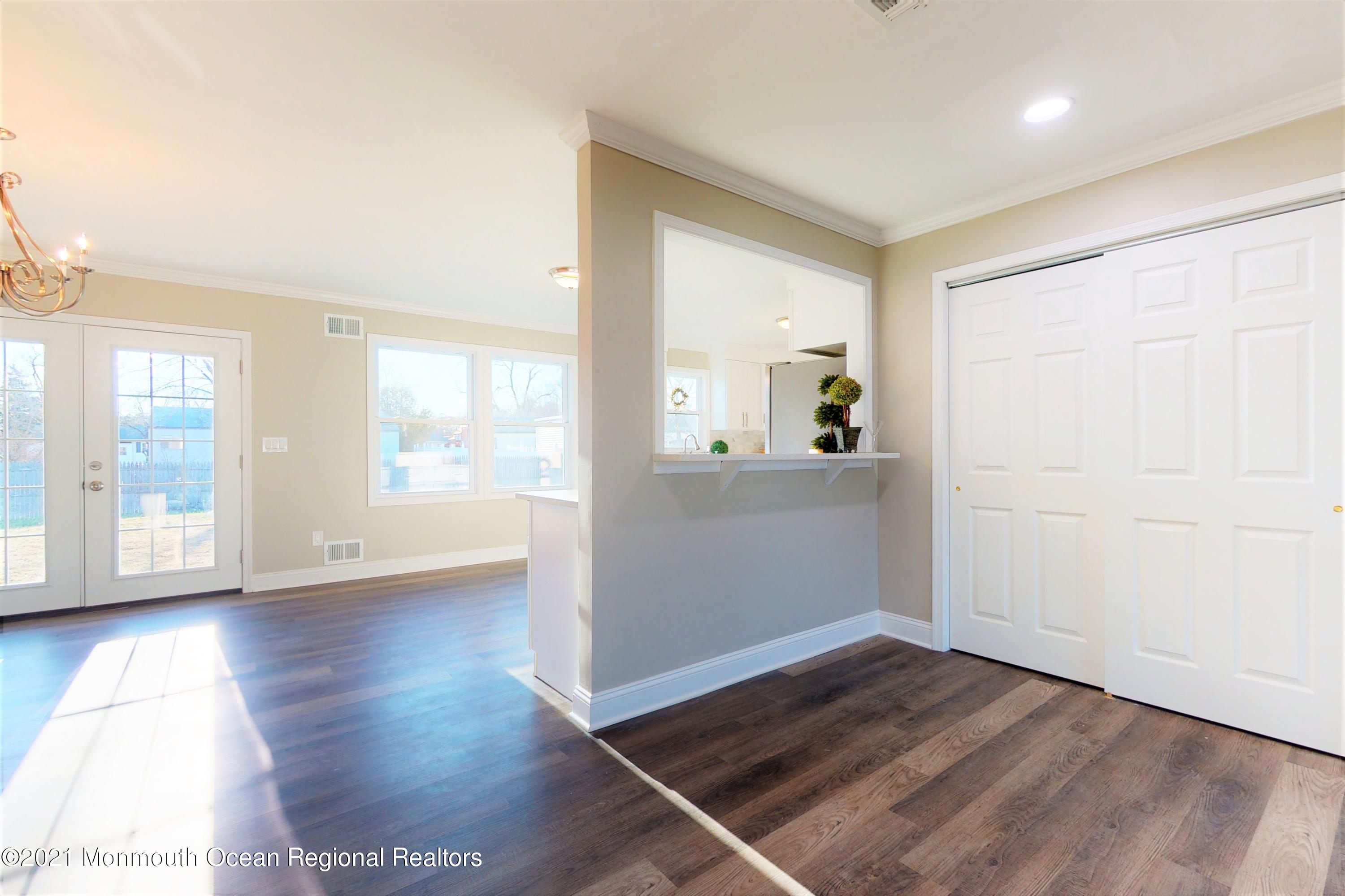 317 Stearman Road Brick, NJ 08723 - Photo 14 of 41 an empty room with wooden floor and windows