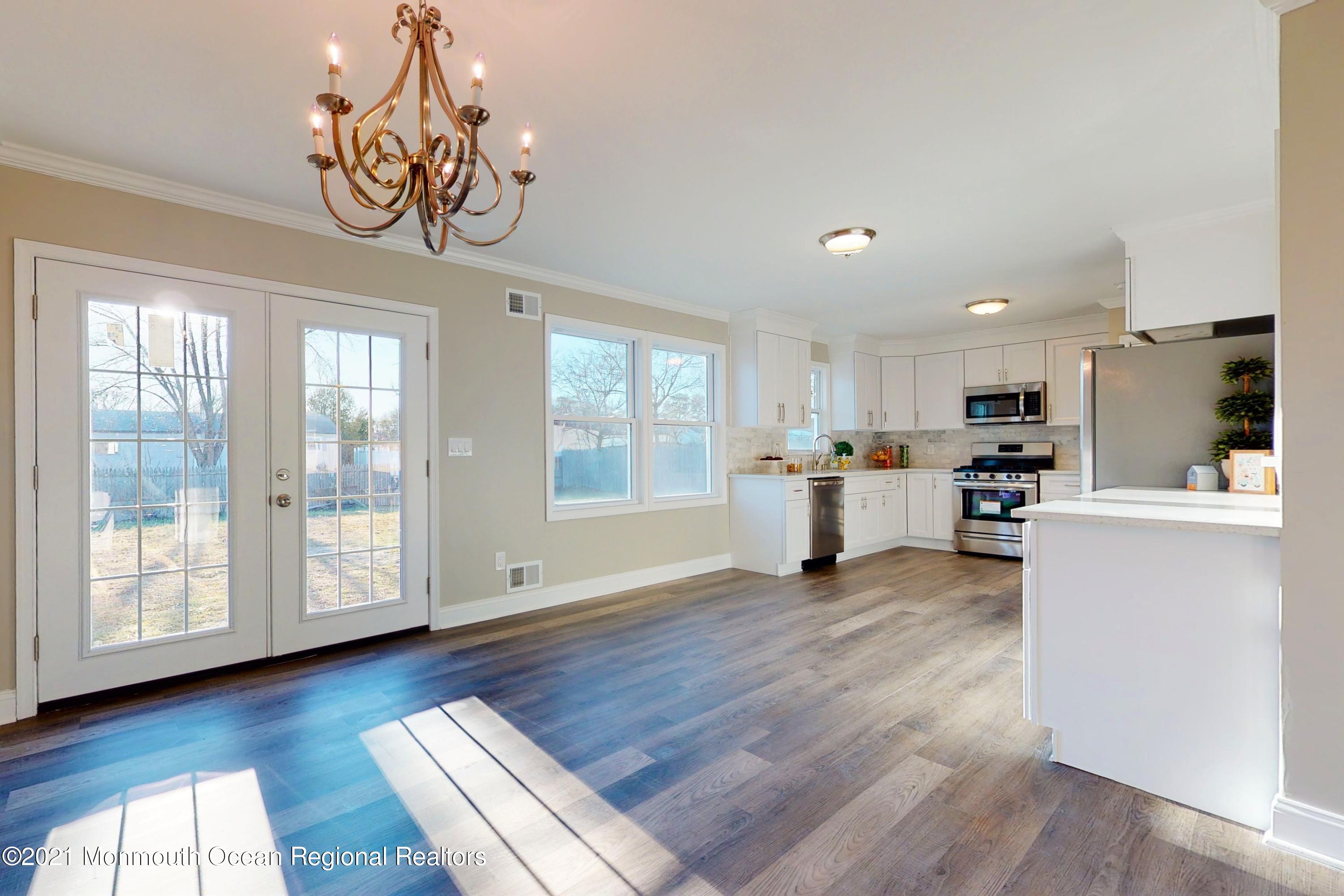 317 Stearman Road Brick, NJ 08723 - Photo 16 of 41 a view of a livingroom with furniture wooden floor and windows