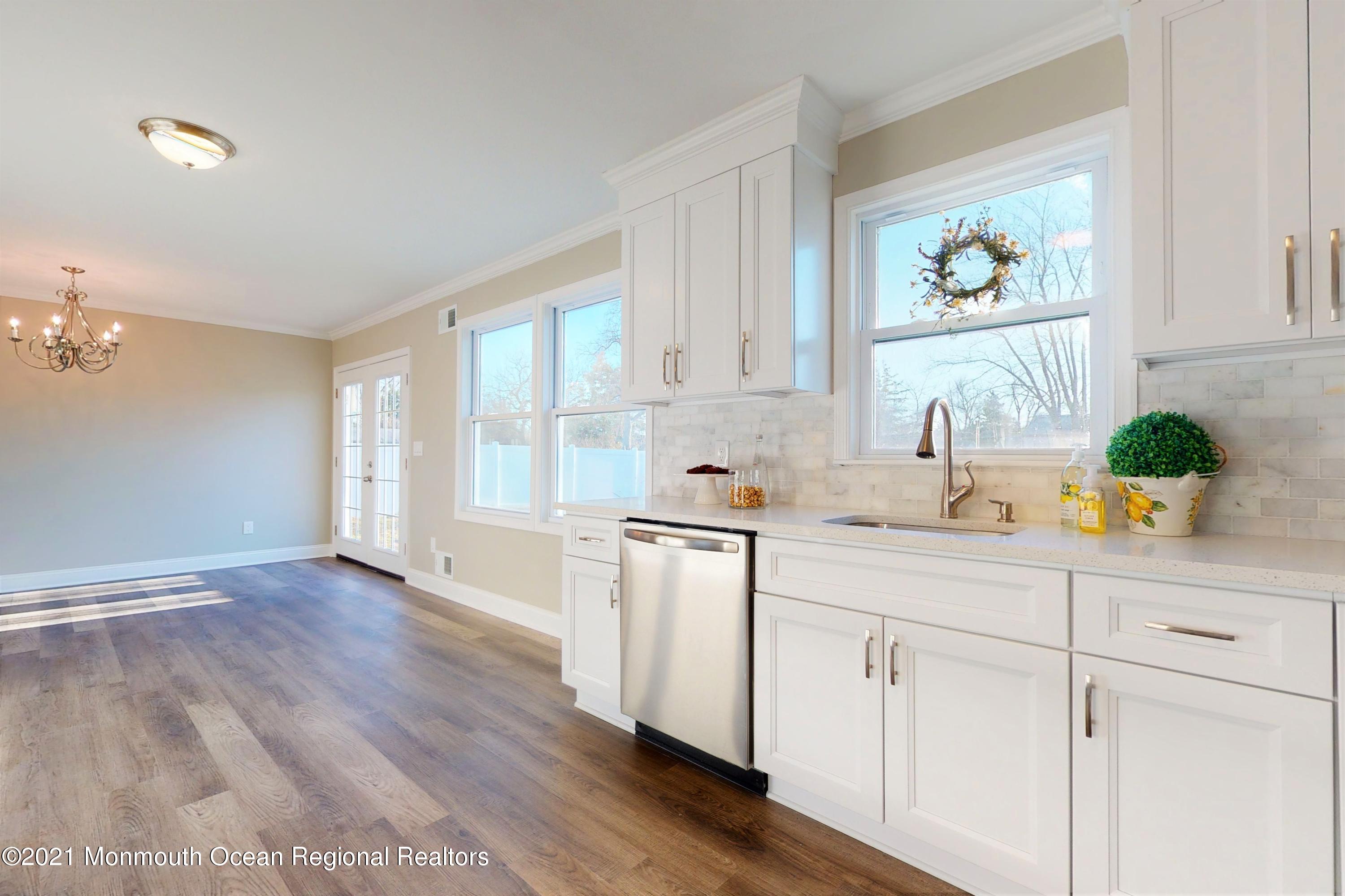 317 Stearman Road Brick, NJ 08723 - Photo 23 of 41 a kitchen with a white stove top oven and white cabinets