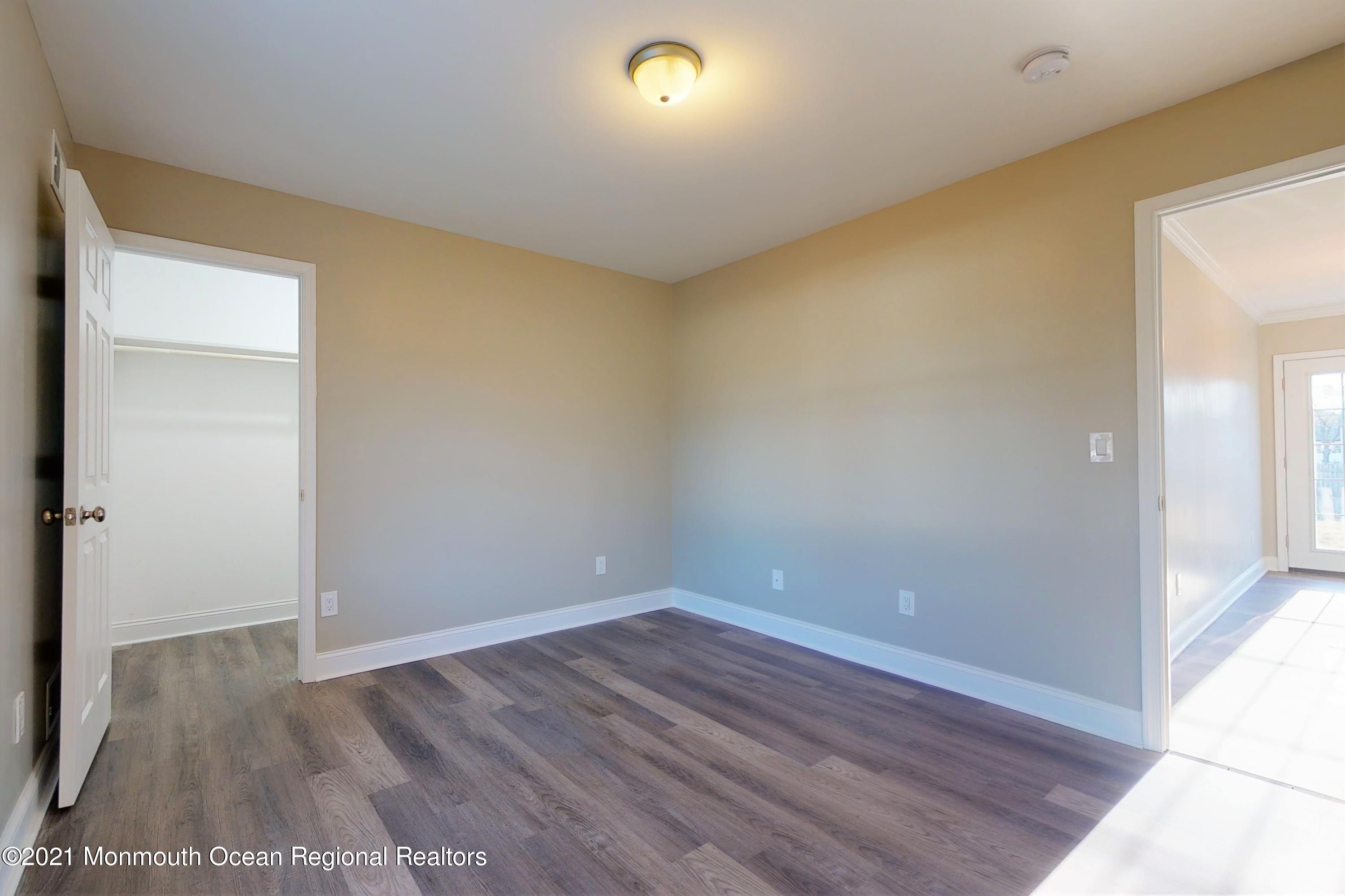 317 Stearman Road Brick, NJ 08723 - Photo 26 of 41 a view of room with wooden floor and window