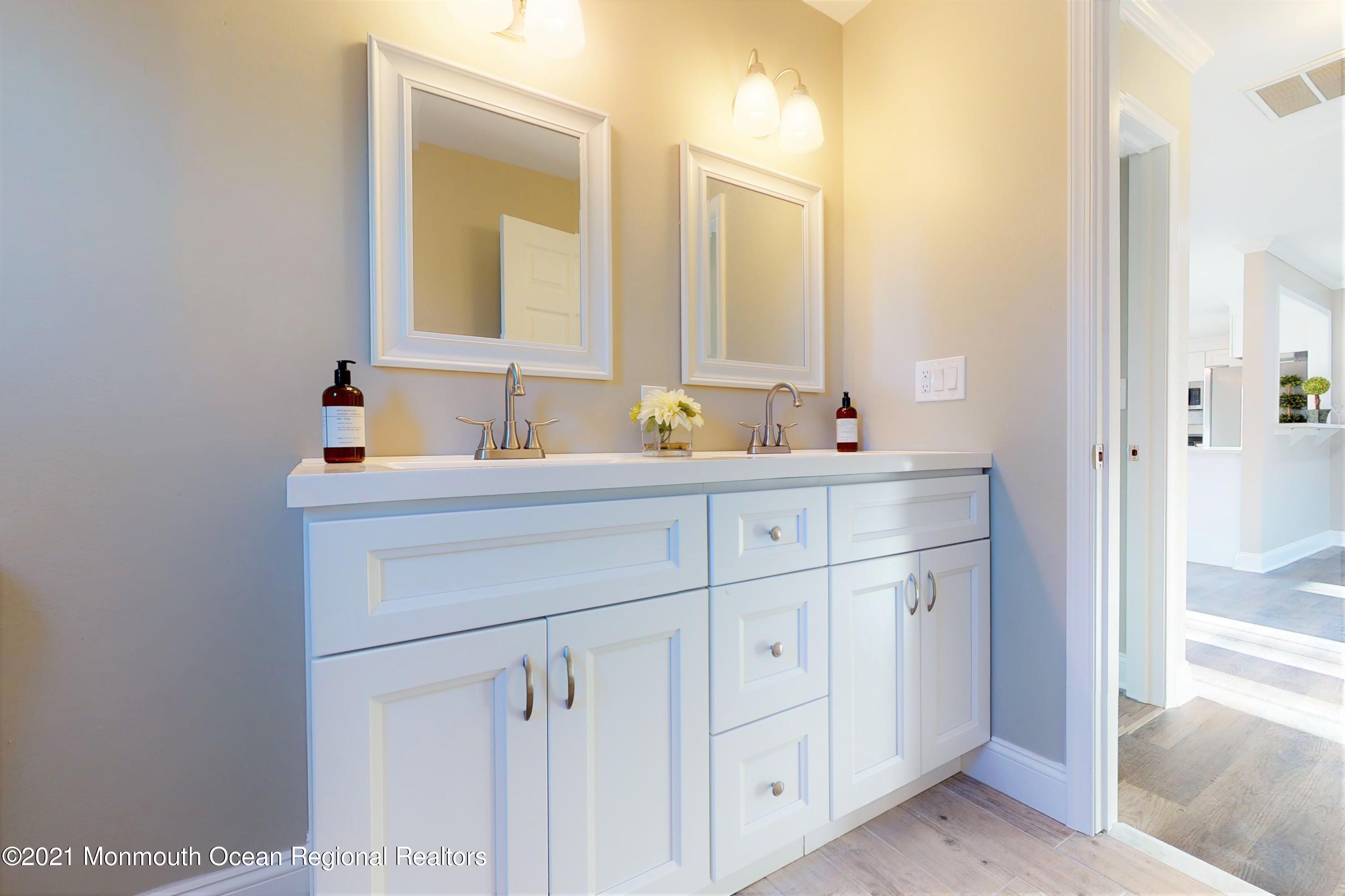 317 Stearman Road Brick, NJ 08723 - Photo 31 of 41 a bathroom with a sink and a mirror