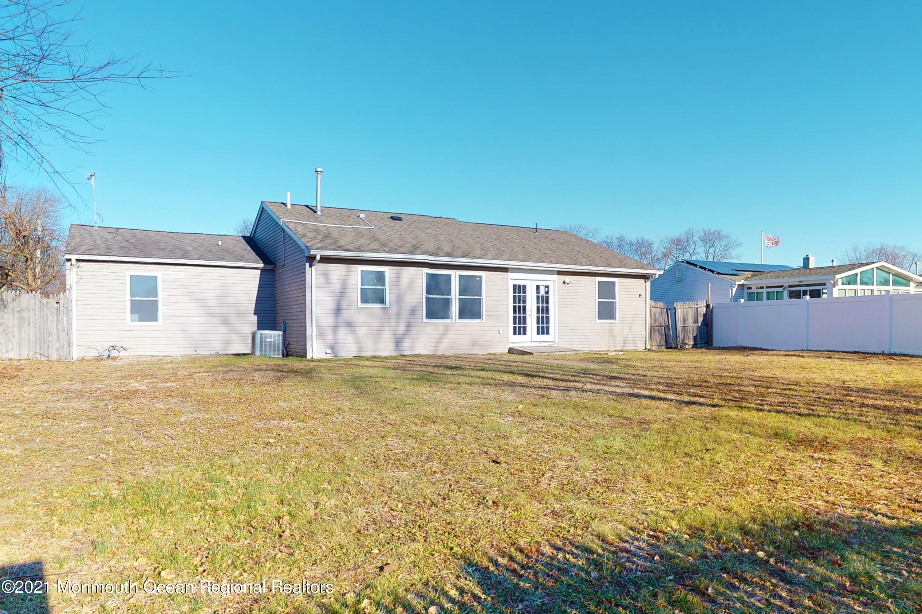 317 Stearman Road Brick, NJ 08723 - Photo 9 of 41 a house with a swimming pool in front of it
