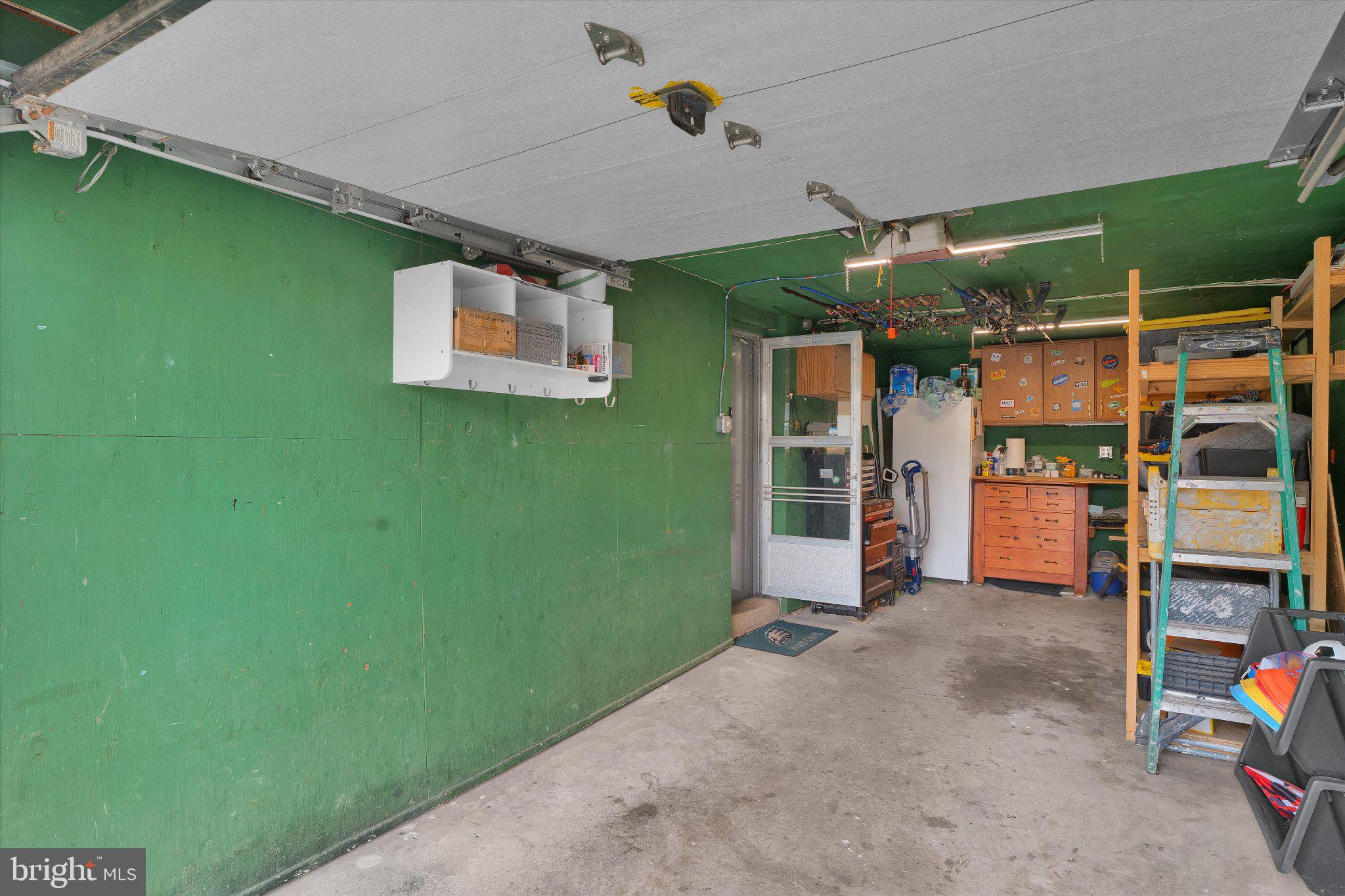 1019 Howard Road Warminster, PA 18974 - Photo 61 of 69 Spacious garage with vibrant green walls.