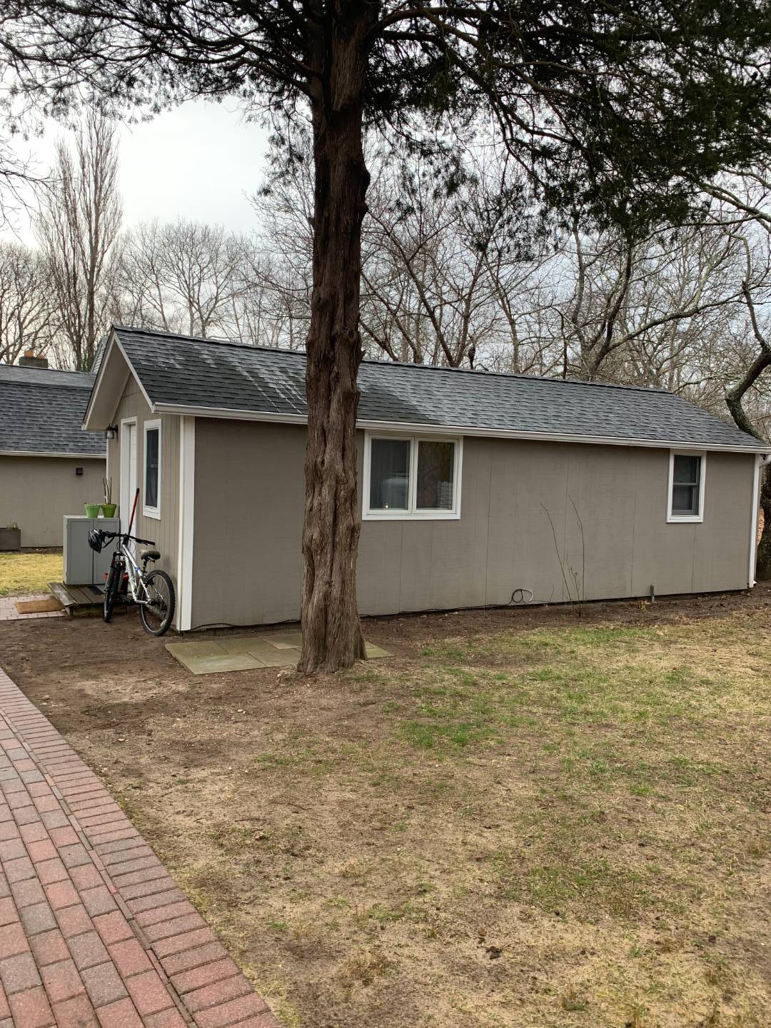 a view of a house with a tree