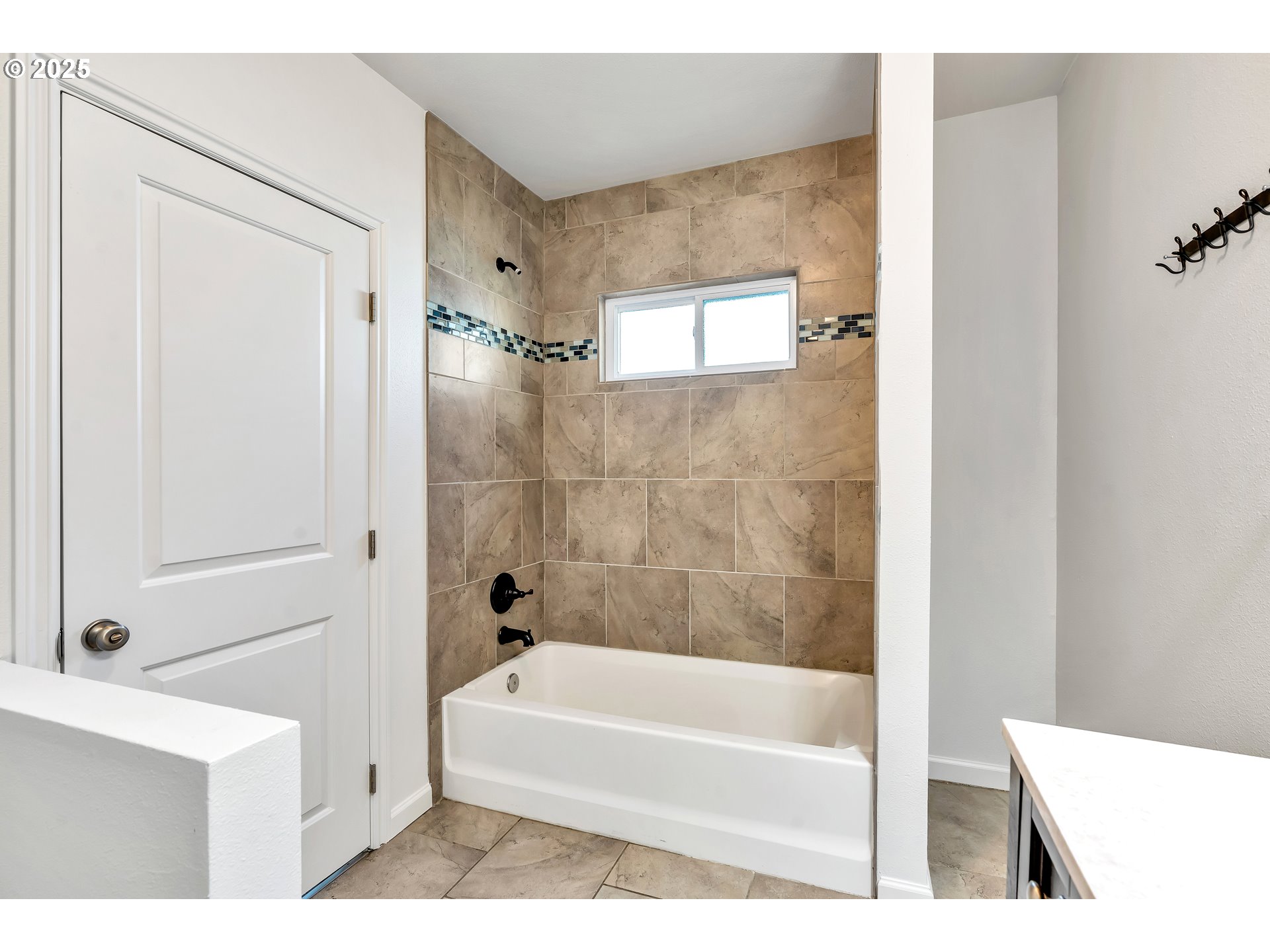 1307 North Kilpatrick Street Portland, OR 97217 - Photo 17 of 46 a white bath tub sitting next to a white sink