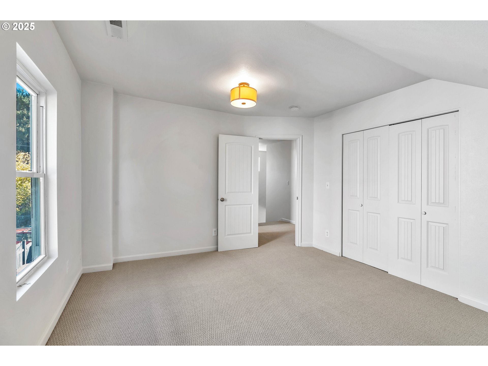 1307 North Kilpatrick Street Portland, OR 97217 - Photo 22 of 46 a view of an empty room with window and an entryway