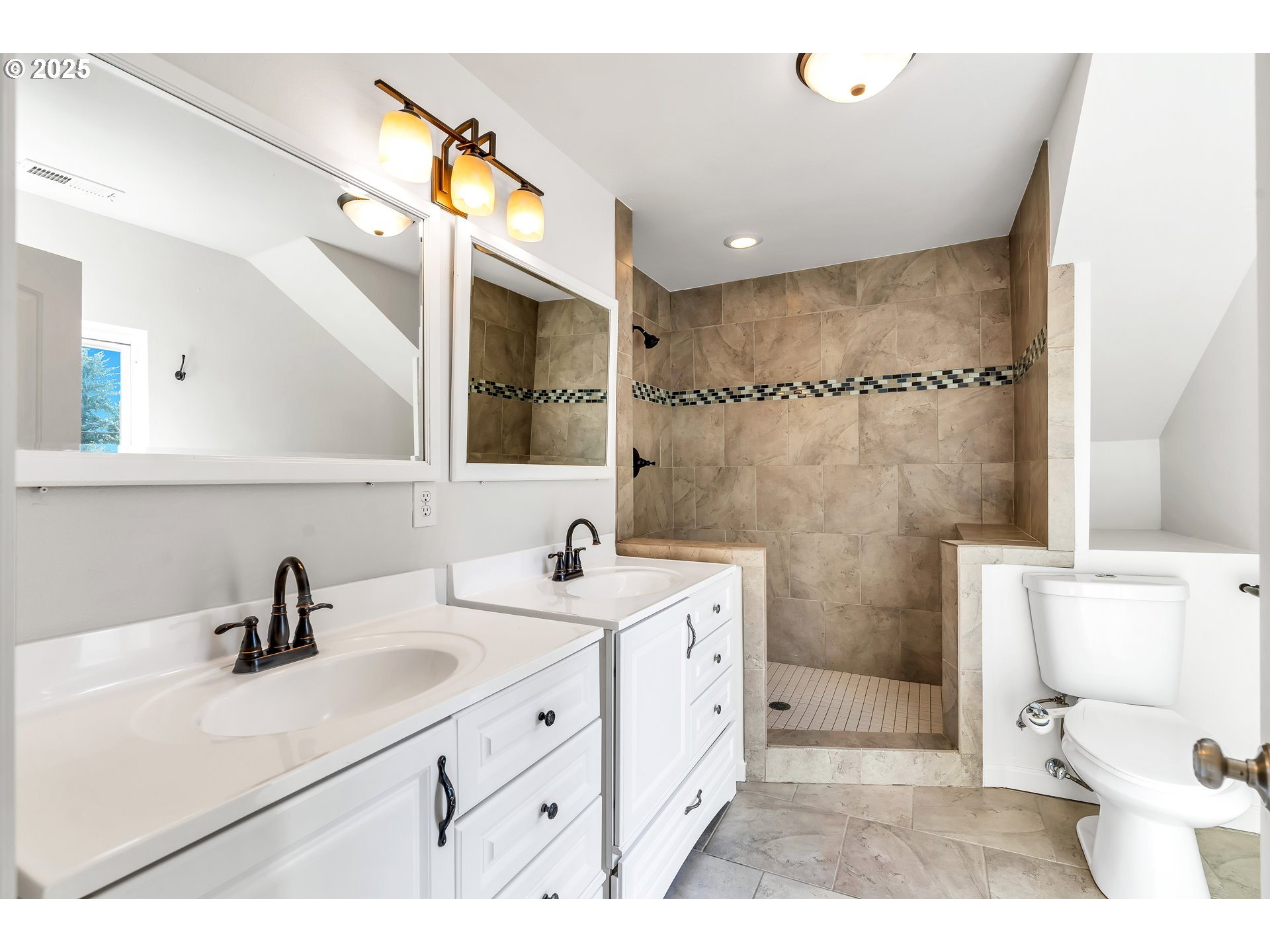 1307 North Kilpatrick Street Portland, OR 97217 - Photo 27 of 46 a bathroom with a sink double vanity and a mirror