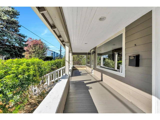 a view of balcony with wooden floor