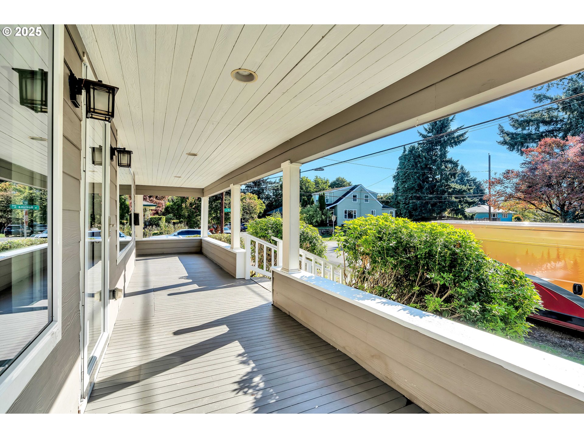 1307 North Kilpatrick Street Portland, OR 97217 - Photo 6 of 46 a view of living room kitchen with large trees and potted plants