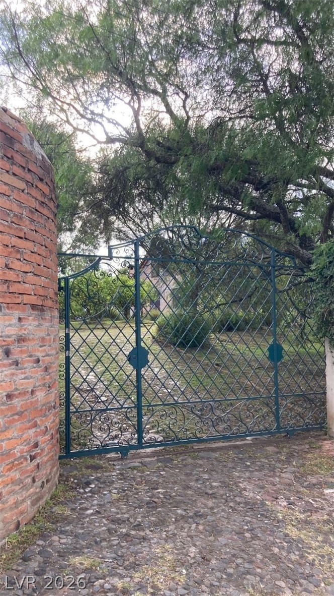 970 La Rabija Shermans Dale, OS 17090 - Photo 16 of 18 Ornate wrought iron gates offer a welcoming entry to this private, verdant estate.