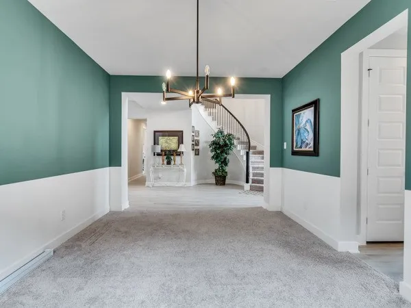 a very nice looking room with a large window and wooden floor