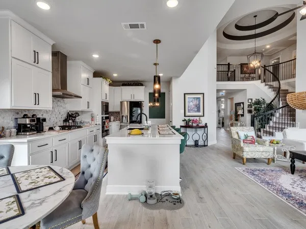 a kitchen with counter top space a sink stainless steel appliances and cabinets